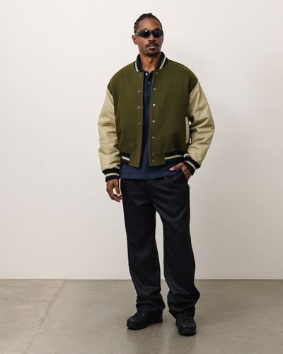 stussy-26ocb1576-denim-tears-varsity-jacket-green.jpg